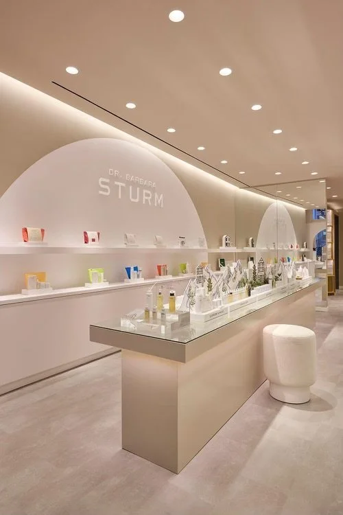 Modern skincare store interior with product displays and bright lighting
