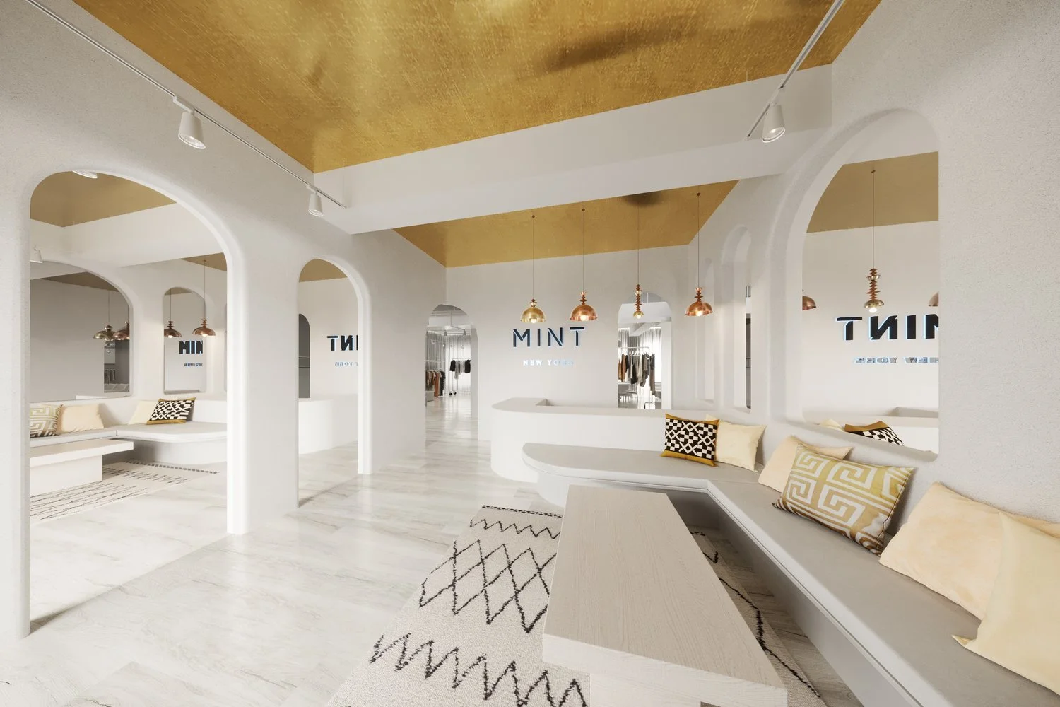 Modern retail interior with white and gold design, featuring arched doorways, a seating area with patterned pillows, pendant lighting, and wall decor reading 'MINT NEW YORK.'
