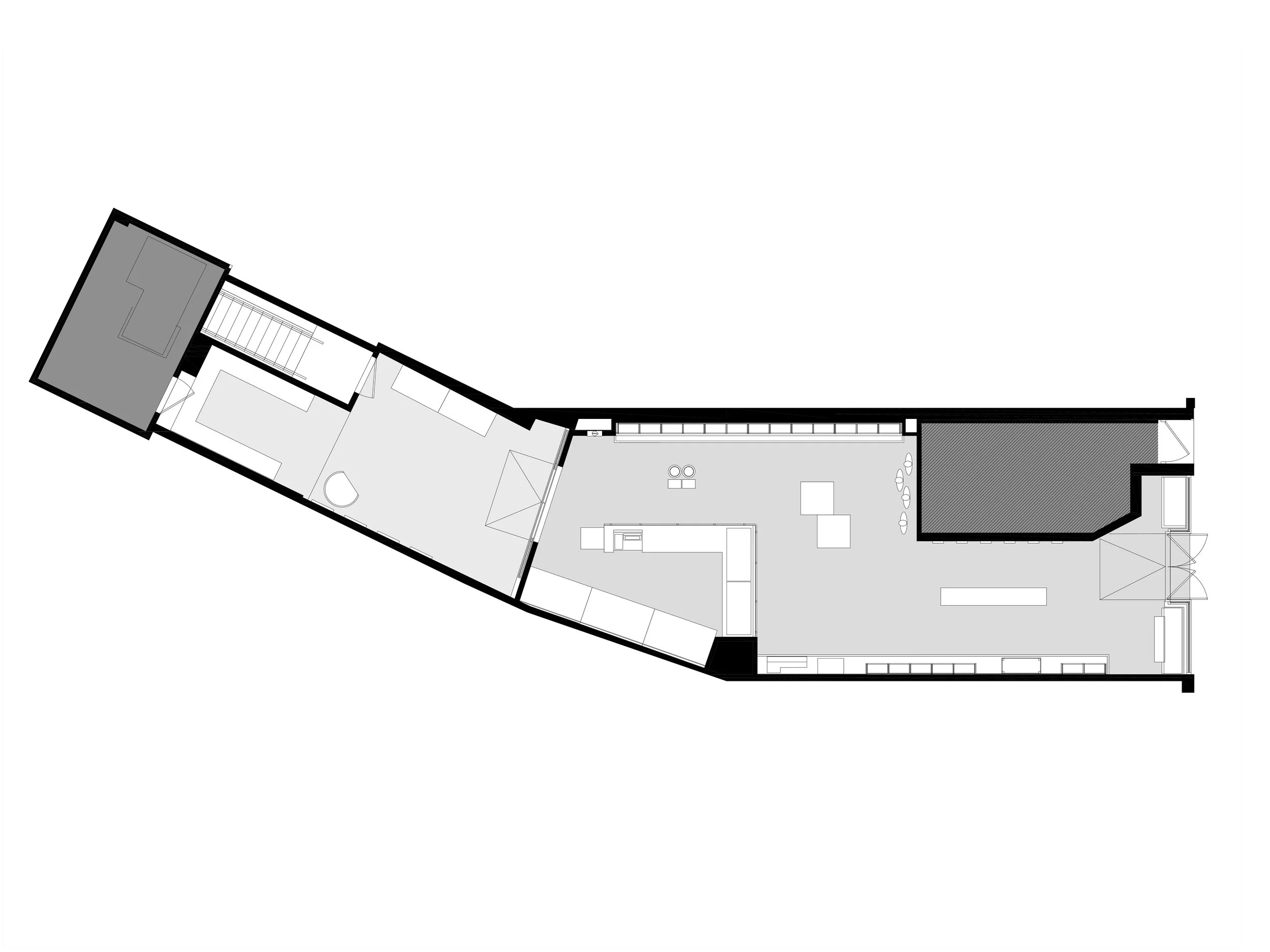 Architectural floor plan of a linear-shaped space, featuring various rooms and open areas.