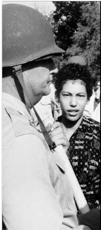  Carlotta Walls escorted into school by the Arkansas National Guard in 1957 by the order of President Dwight D. Eisenhower