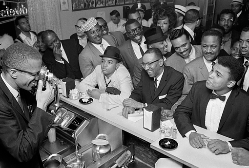 Malcolm X having a little fun with the Champ, Muhammad Ali