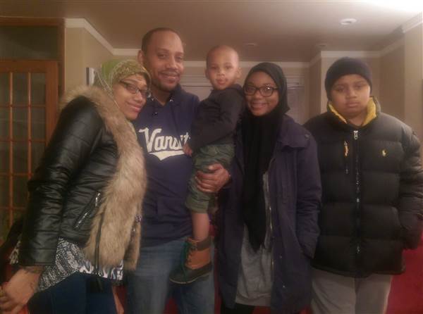 Jihad Ahmed with four of his eight kids: (left to right) Ahmed's daughter Ahmed (20), son Suhayb (3), daughter Ameenah (17), and son Aqil (15). Jihad Ahmed