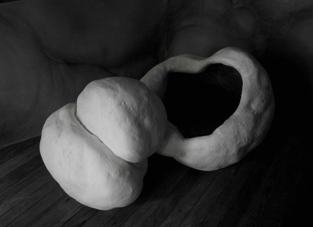 Two forms: a morphing sculpture , Plaster, 37 X 41 X 28 inches and 24 X 17 X 22 inches, 2014.