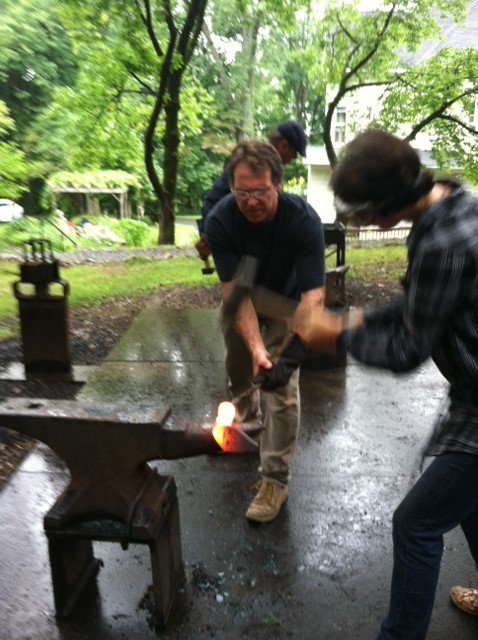 Beating the hot steel, a two persons job.