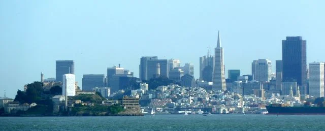 Alcatraz lower left hand side as seen from the boat, with the City in the backgound