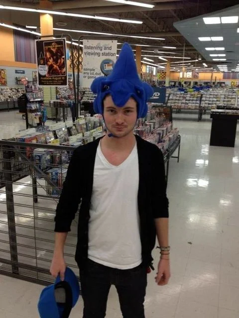 Joe trying on new hats