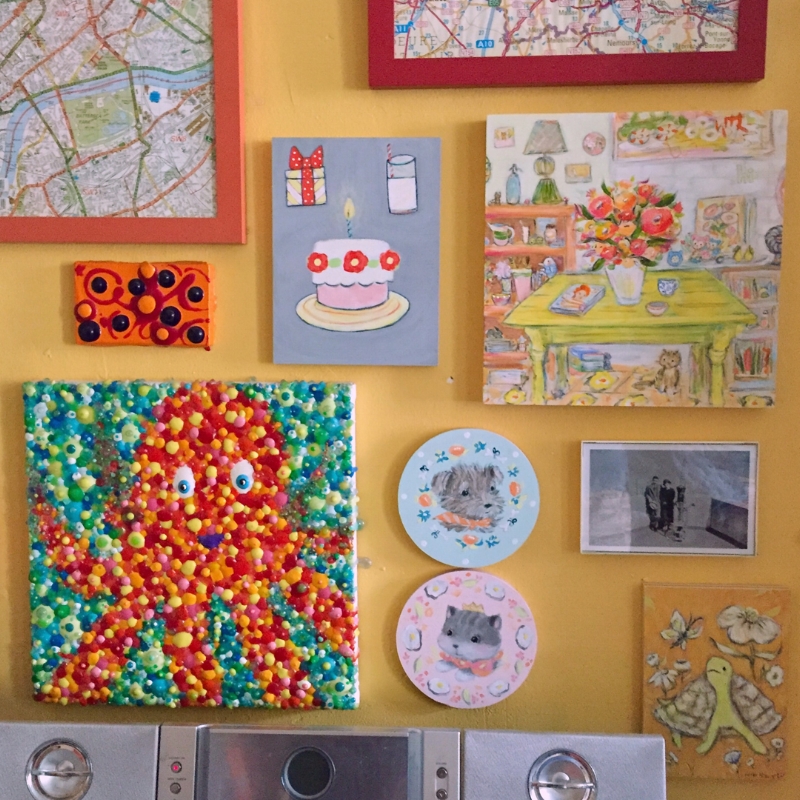 Paintings hang salon style in my place.