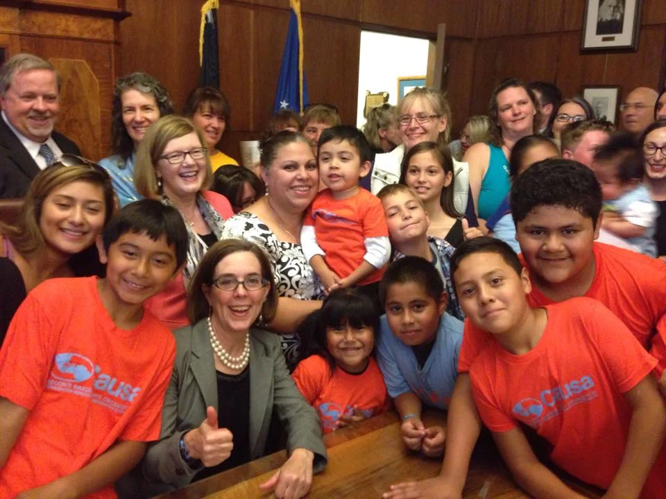 Causa members with Governor Brown after she signed paid sick days legislation. 