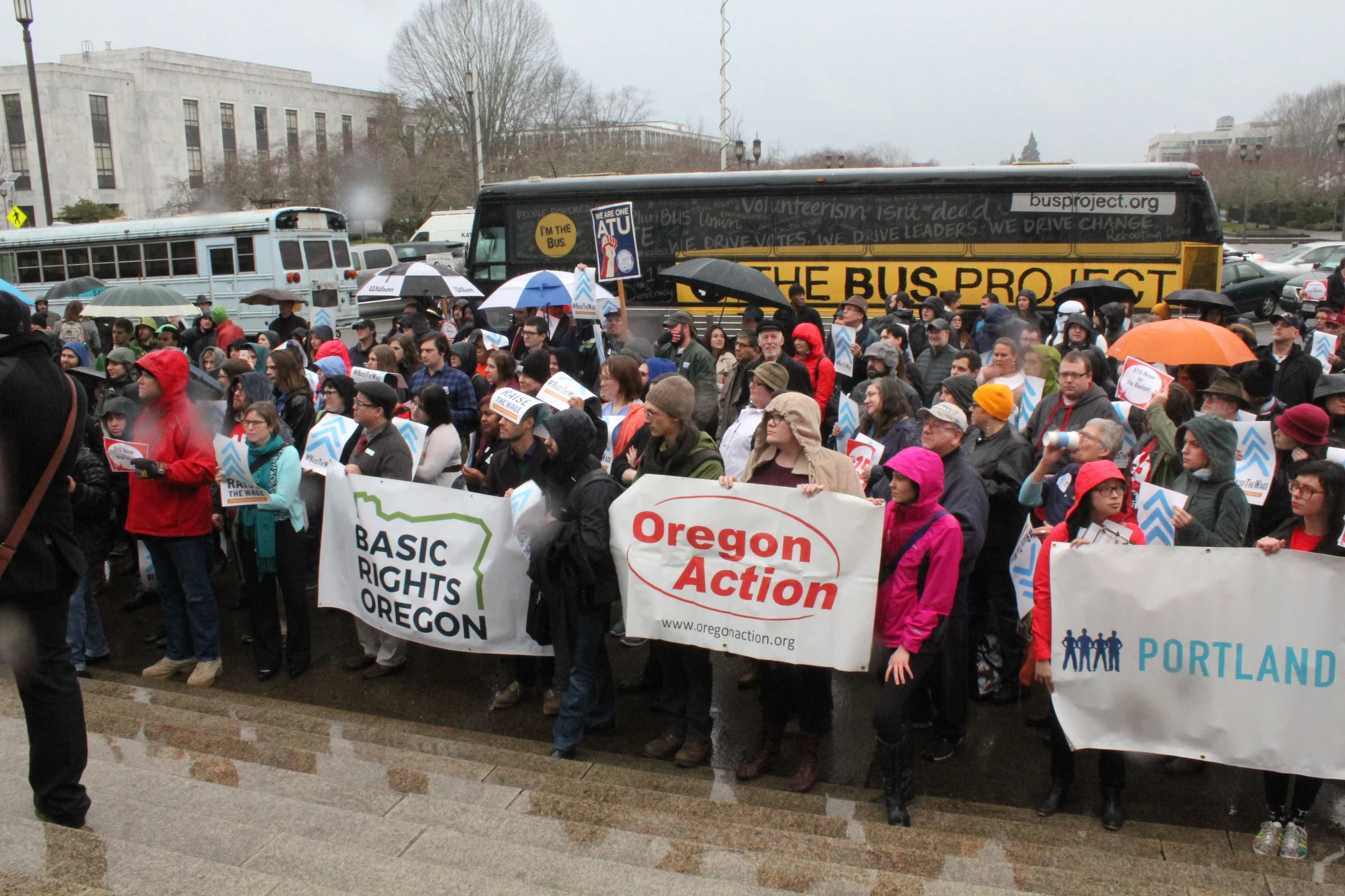 Oregonians rally to raise the wage in front of The Bus!
