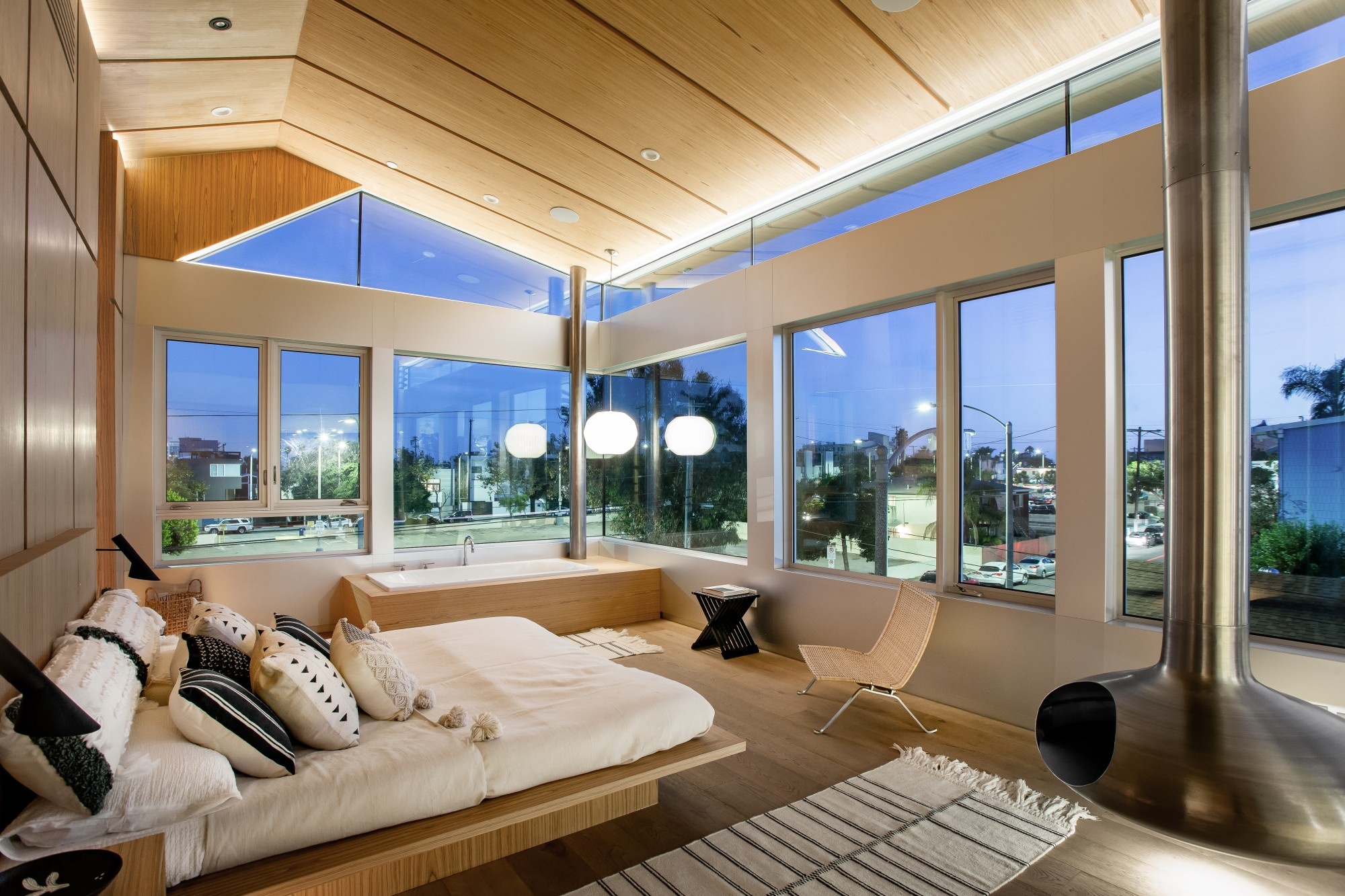 Alberta Beach Lofts The third level has 2 bedrooms including the master w/ocean views, stainless steel fire-orb suspended fireplace & fully embossed teak millwork walk-in closet.