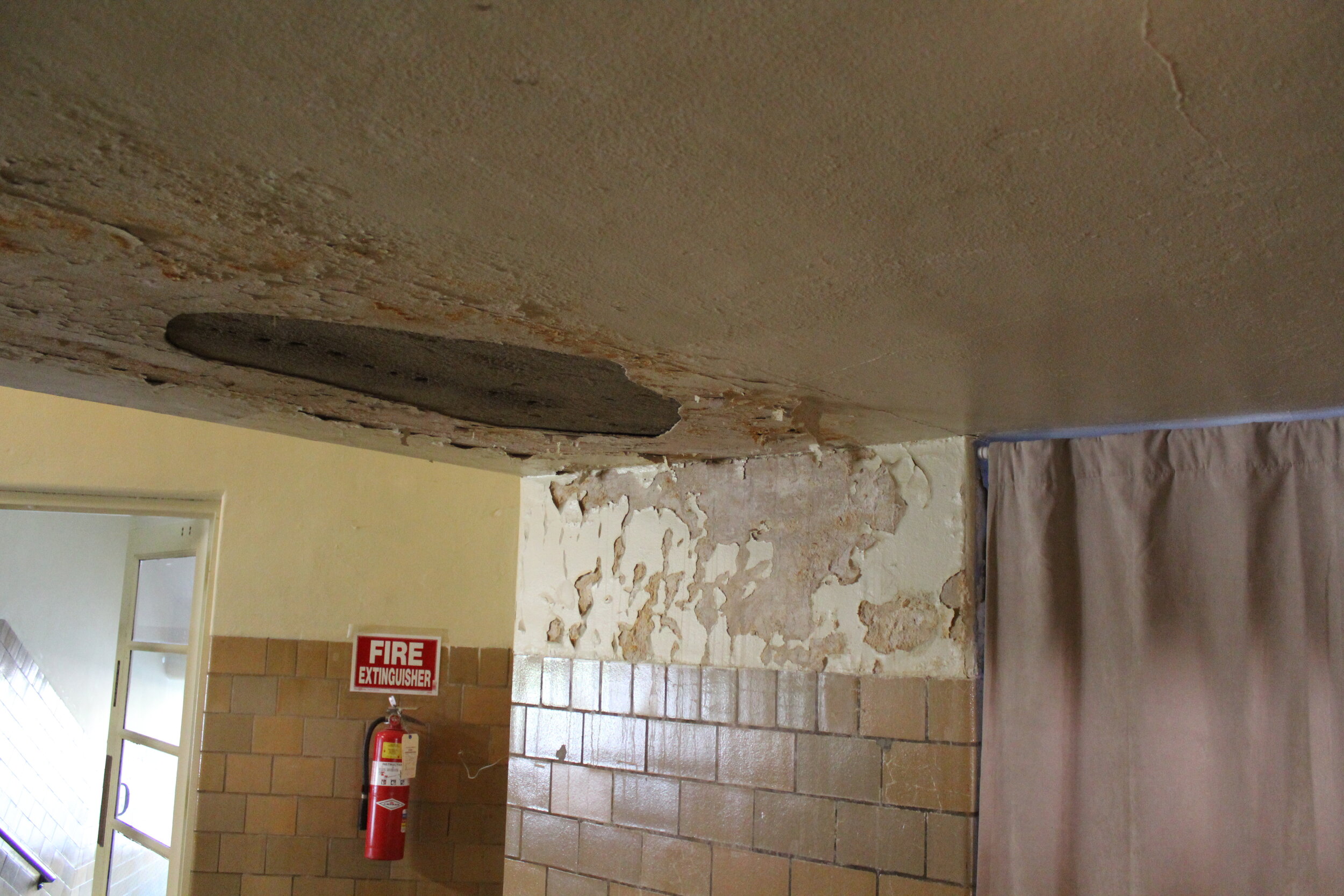 Interior ceiling damage at gym entrance.JPG