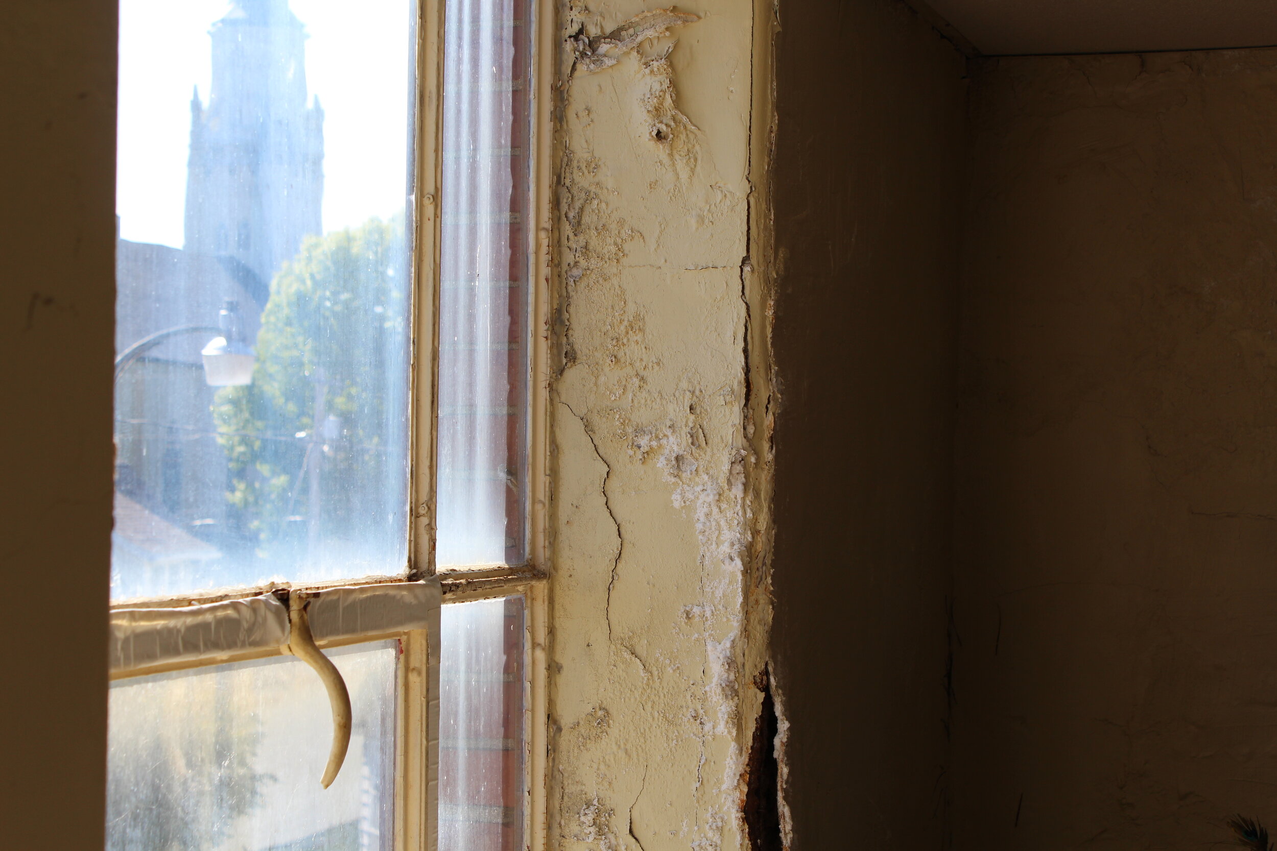 Interior Window and wall damage up stairs storage.JPG