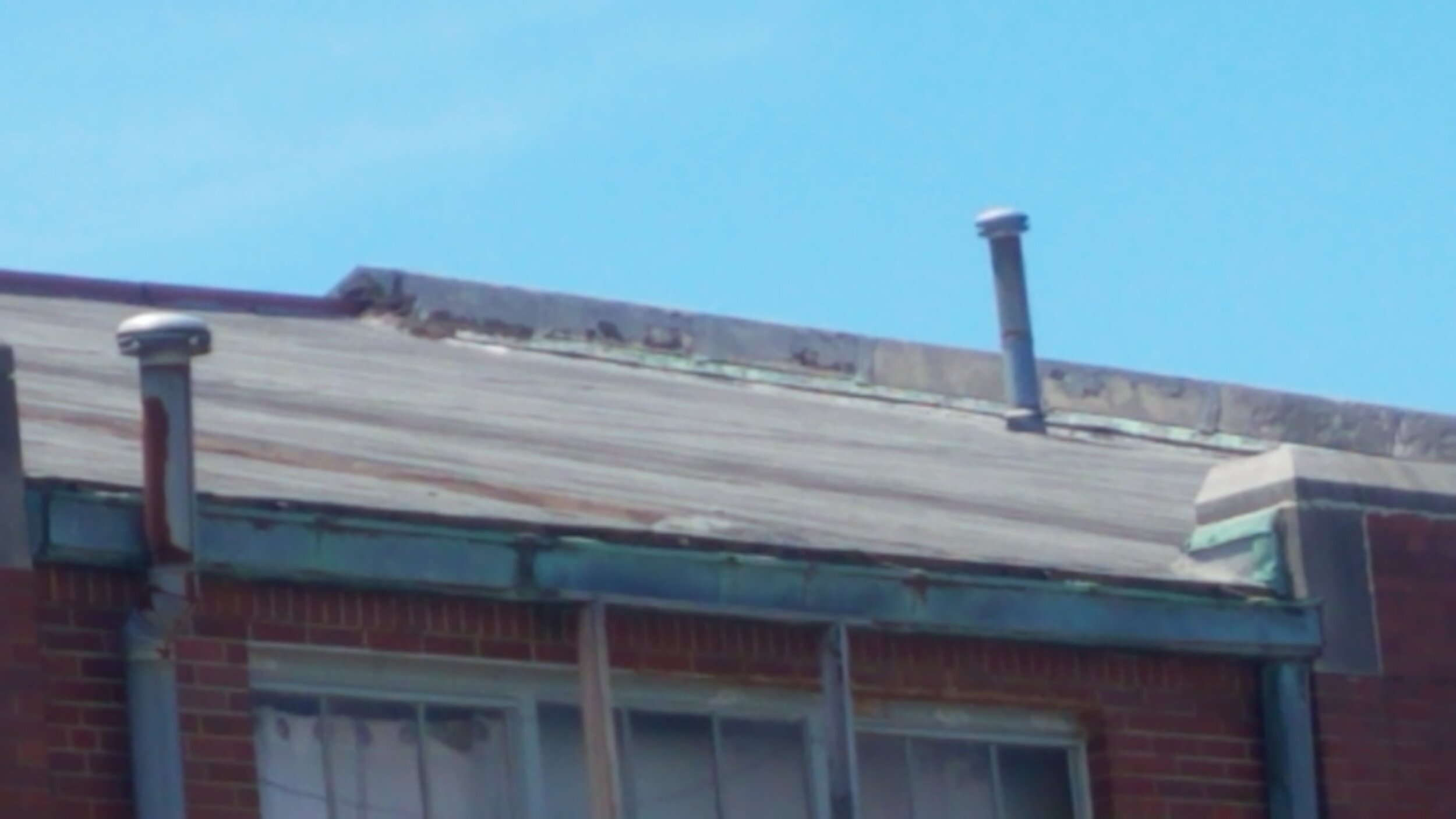 Old Gym Roof and Gutters 2.jpg