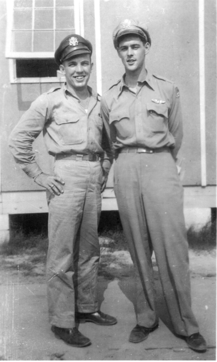 Lt. Bruce, right, talks with his original copilot, Lt. William Brown. Brown was injured prior to the Kassel Mission and removed from the crew. 