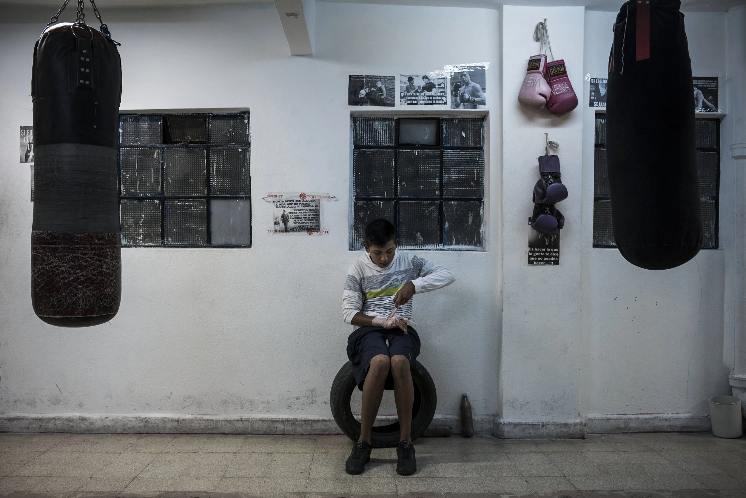  Mexico City, Mexico- Feb 28, 2017:  Fifteen year-old Pancho, an aspiring boxer from Morelos, wraps his hands before training on February 28, 2017 in the Tepito neighborhood of Mexico City. Pancho's coach, Jorge Angeles, hopes he'll compete in Mexico