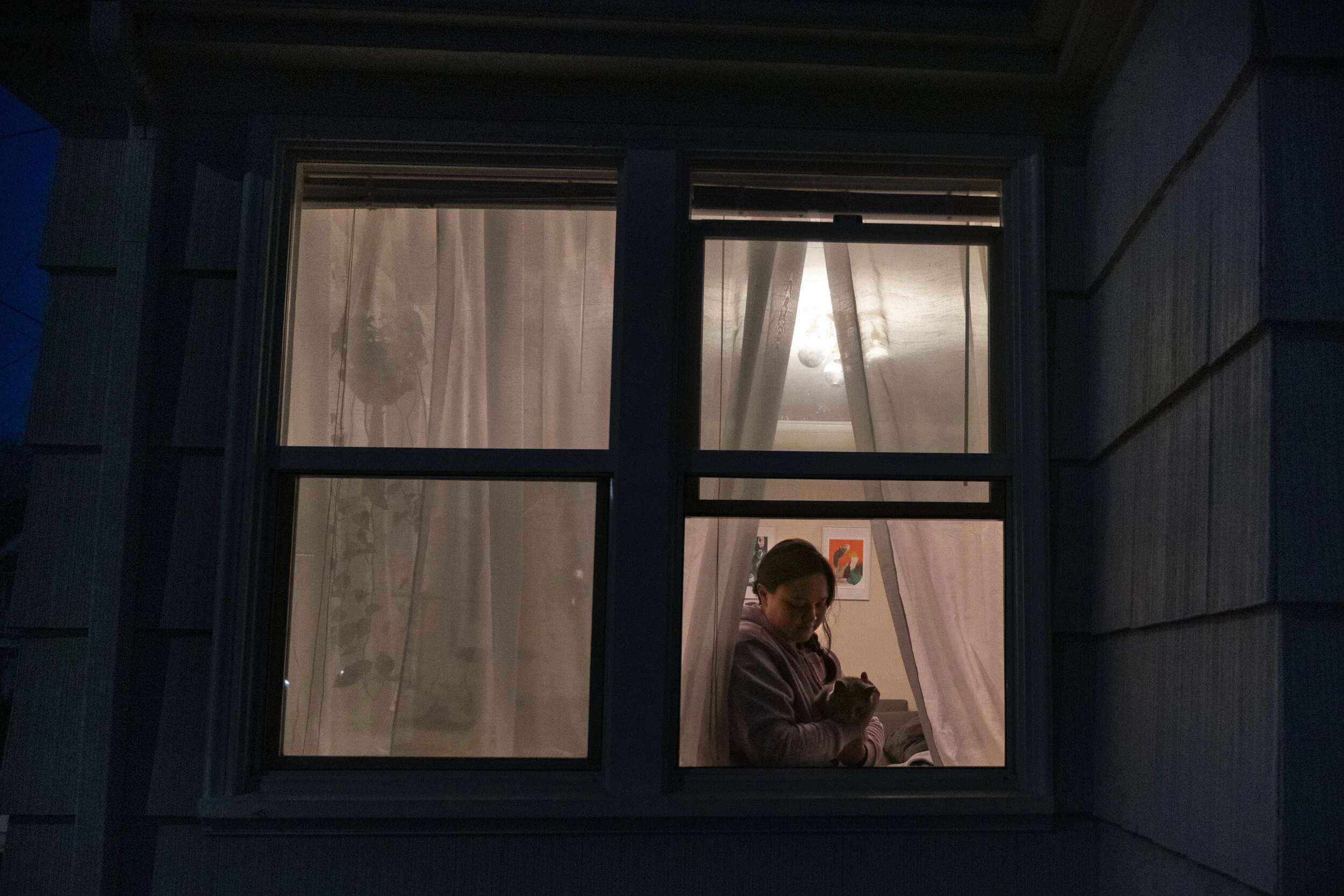  Shannon Axelson and her cat Jam stand for a portrait in their home 20 days after the first coronavirus case in Oregon on March 19, 2020 in Portland, Oregon. 