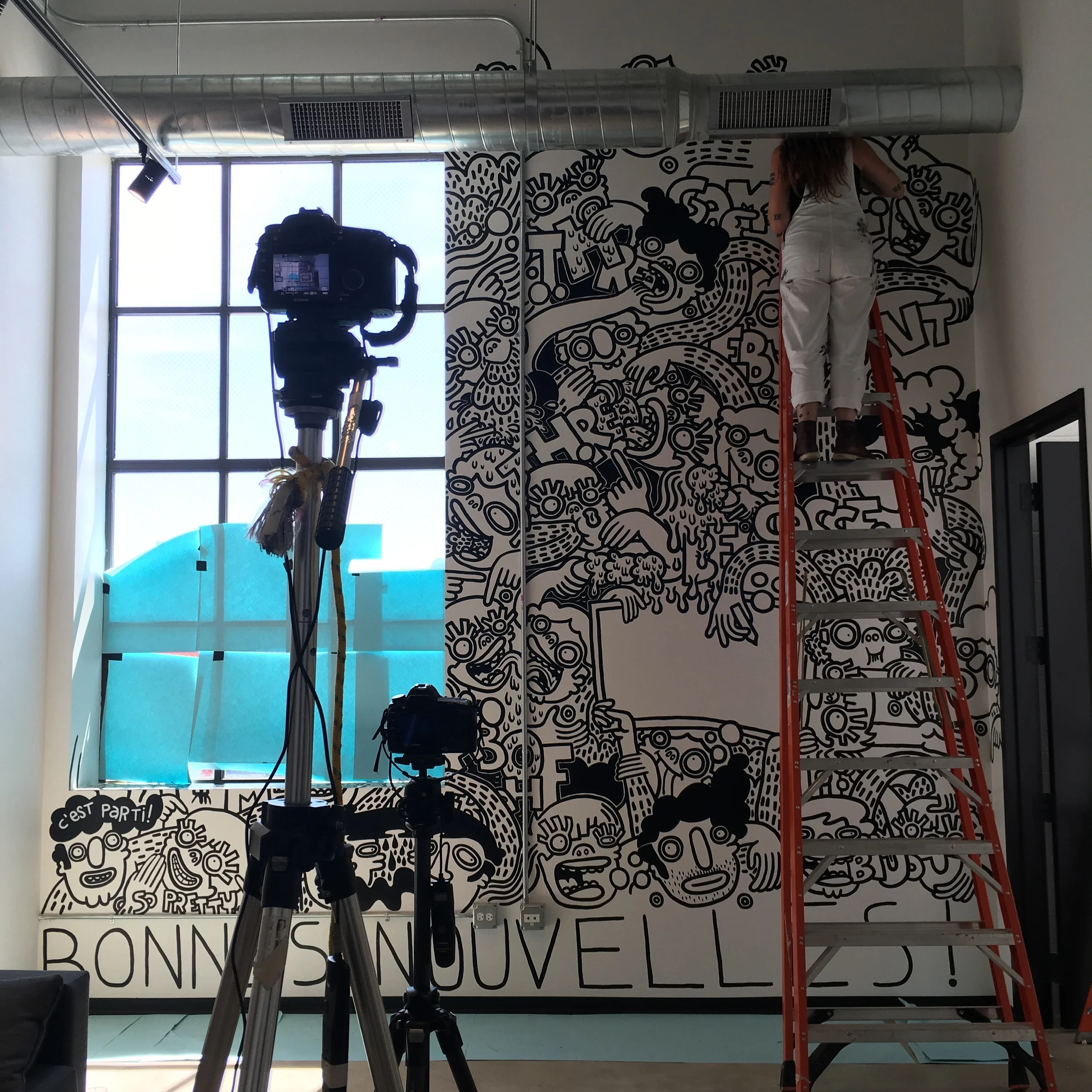 SO CLOSE TO BEING DONE. THOSE TIMELAPSE CAMERAS TOOK THOUSANDS OF PICTURES DURING THE CREATION OF THIS MURAL.