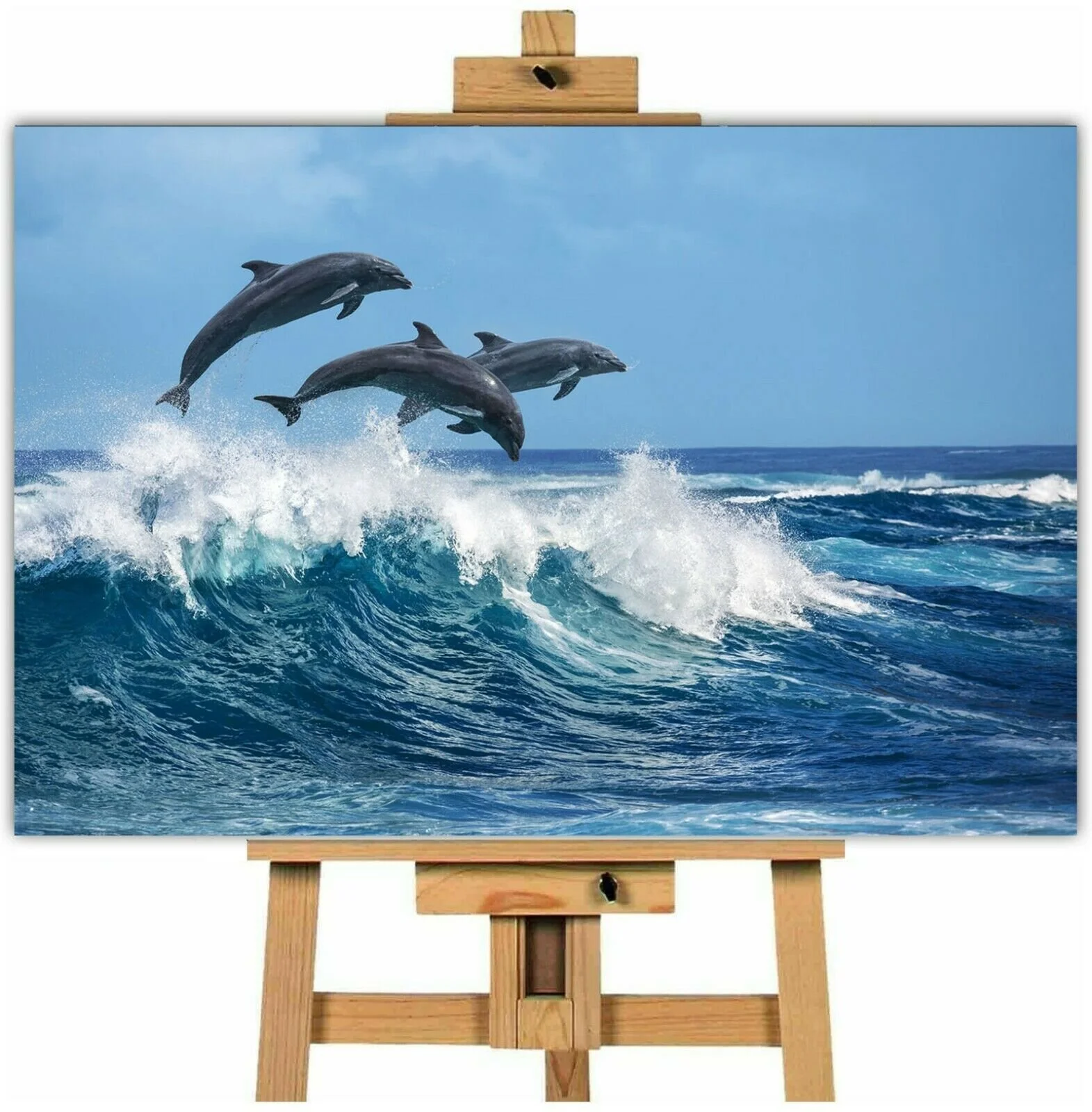 Three dolphins jumping in the ocean canvas wall art print.jpg