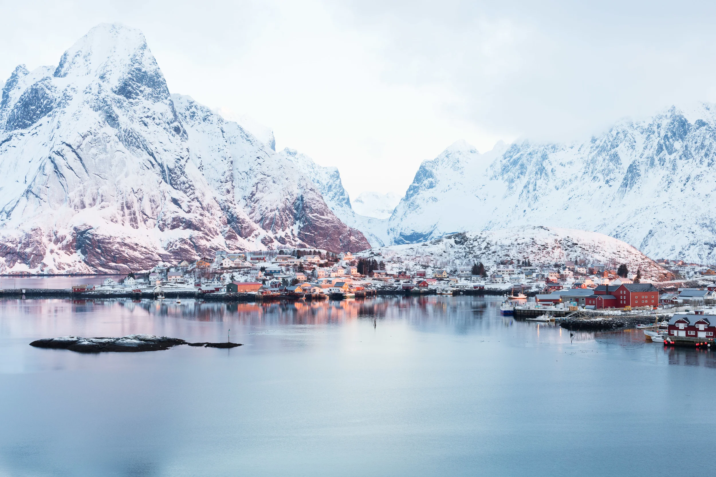 Reine, Lofoten. The sun is just above the horizon and creates the magic arctic light.