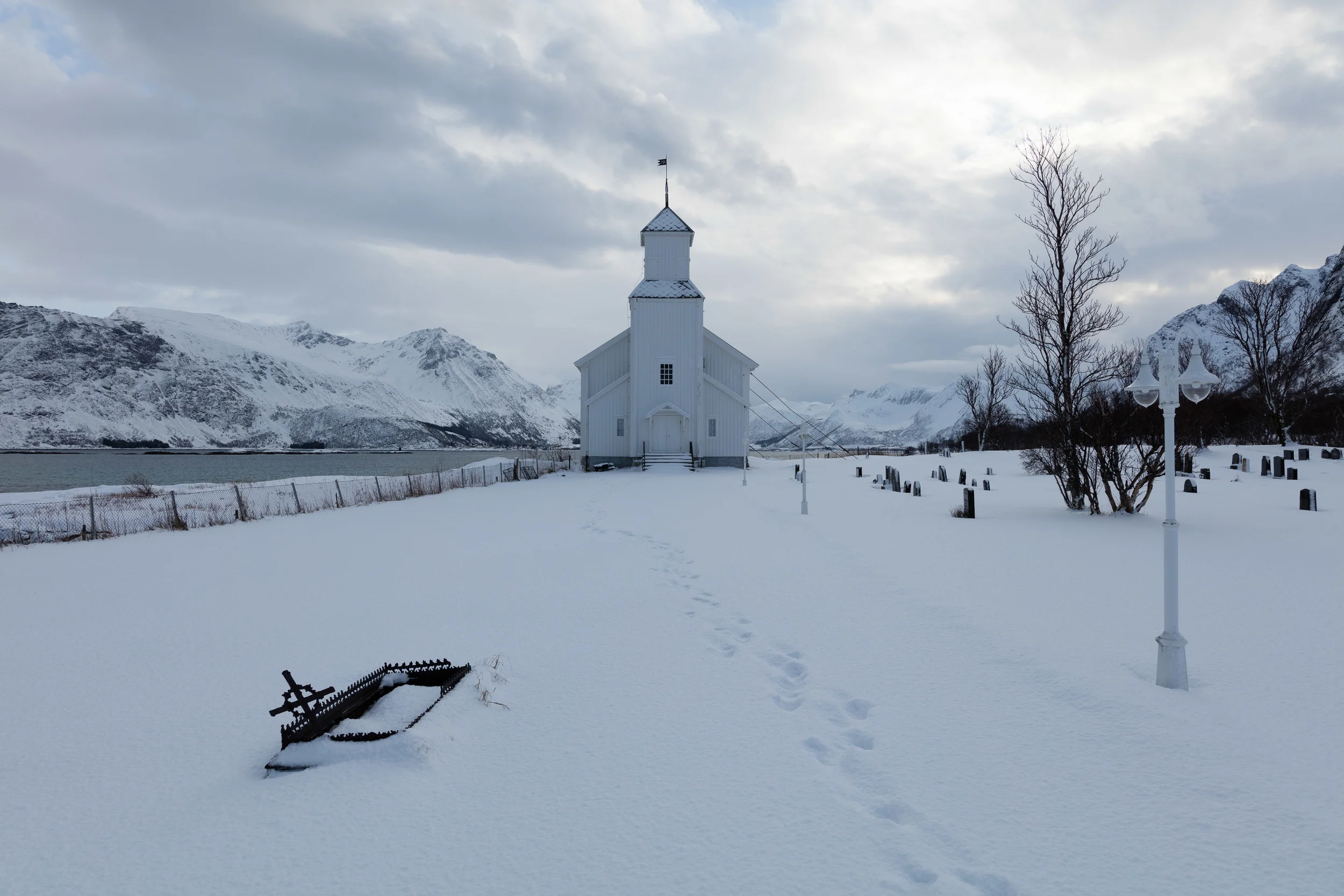 Gimsøy, Lofoten. Gimsøy Church is really tied to the ground due to weather conditions. The wind can be really strong in this area. Many local fishermen are laid to rest here.