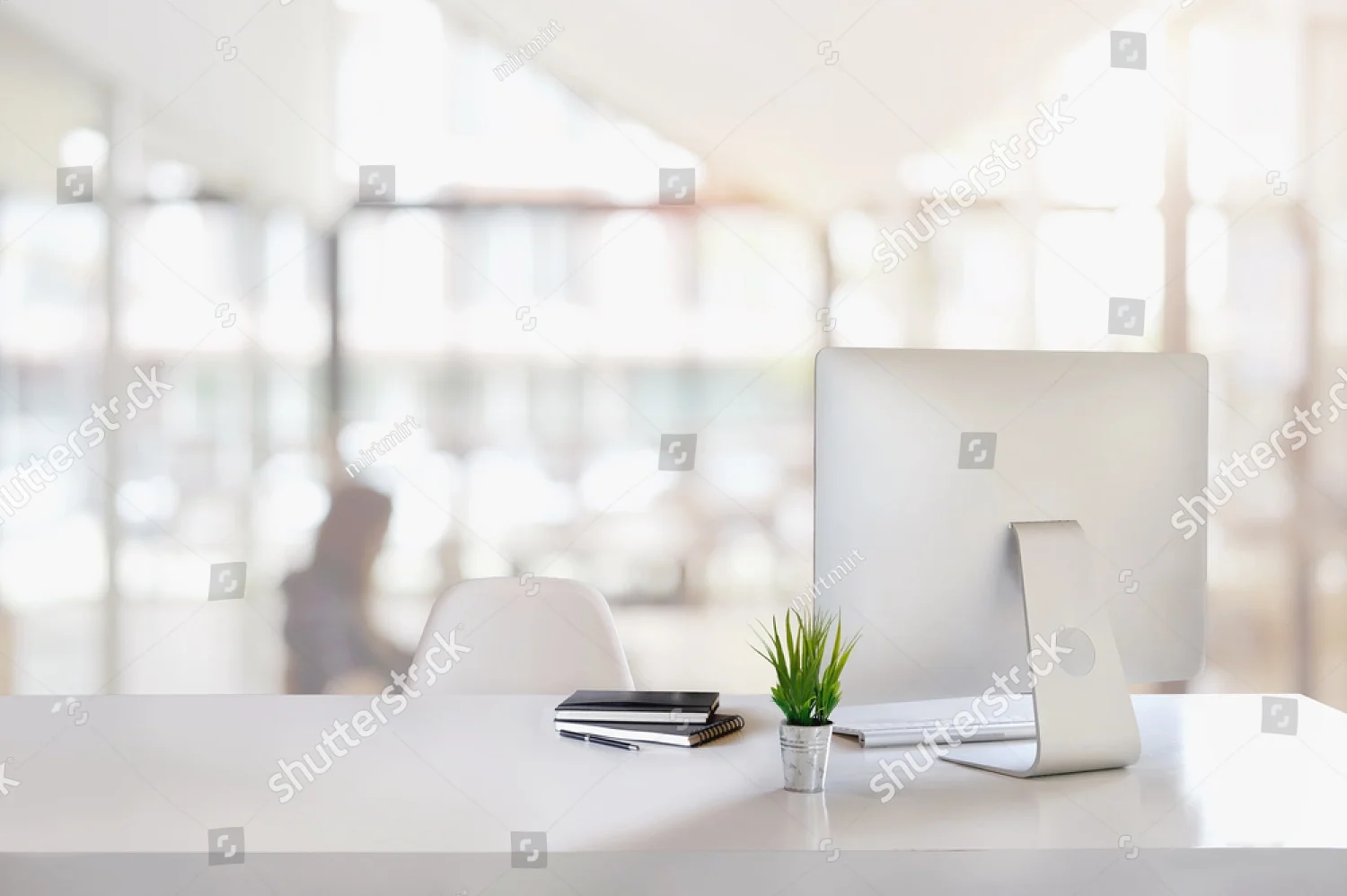 stock-photo-stylish-workspace-with-desktop-computer-office-supplies-houseplant-and-books-at-office-desk-work-712481386.jpg