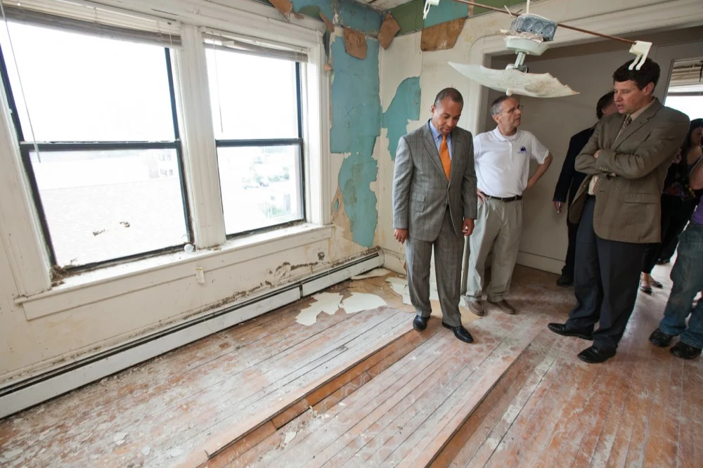 Friday, May 25, 2012 - Governor Deval Patrick observes the damage at the Center City Apartments from the June 1, 2011 tornadoes.
(Photo: Eric Haynes / Governor's Office)