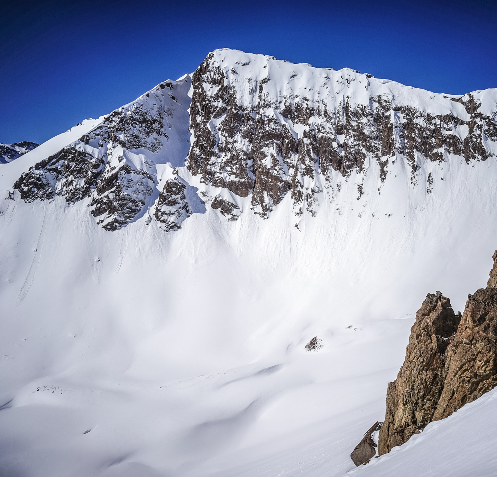 I took this photo on my phone a year ago of a line some folks call 'Peruvian.' This peak is an unnamed point near Indy Pass. Though not that big or long, I've really wanted to ski it all season. Today Vince and I climbed up in a snowstorm and skied down in the sun. 