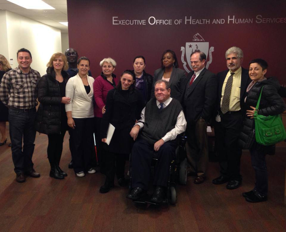 Charlie and his MRC senior team take a photo with foreign exchange visitors.