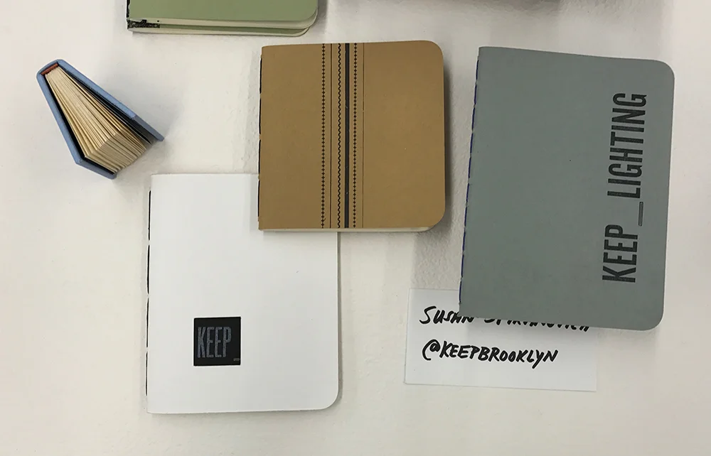 Pamphlet-bound notebooks with covers letterpress-printed from wood and metal type.