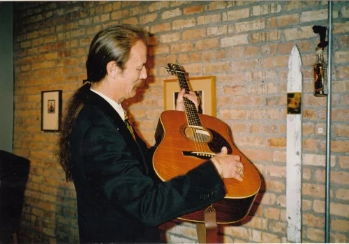 Another musical hero, Tony Rice having a look at my Santa Cruz Tony Rice model guitar.