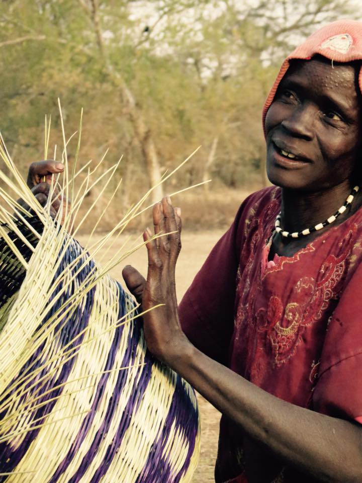 Achan tonj makes a basket in the village of Aker adoor. 