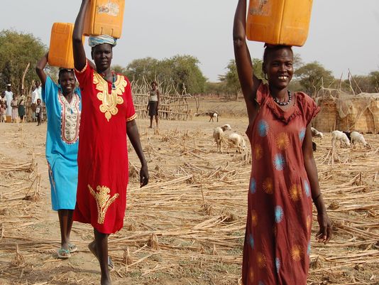 Women carrying water in South Sudan. Photo by Ben Dobbin.