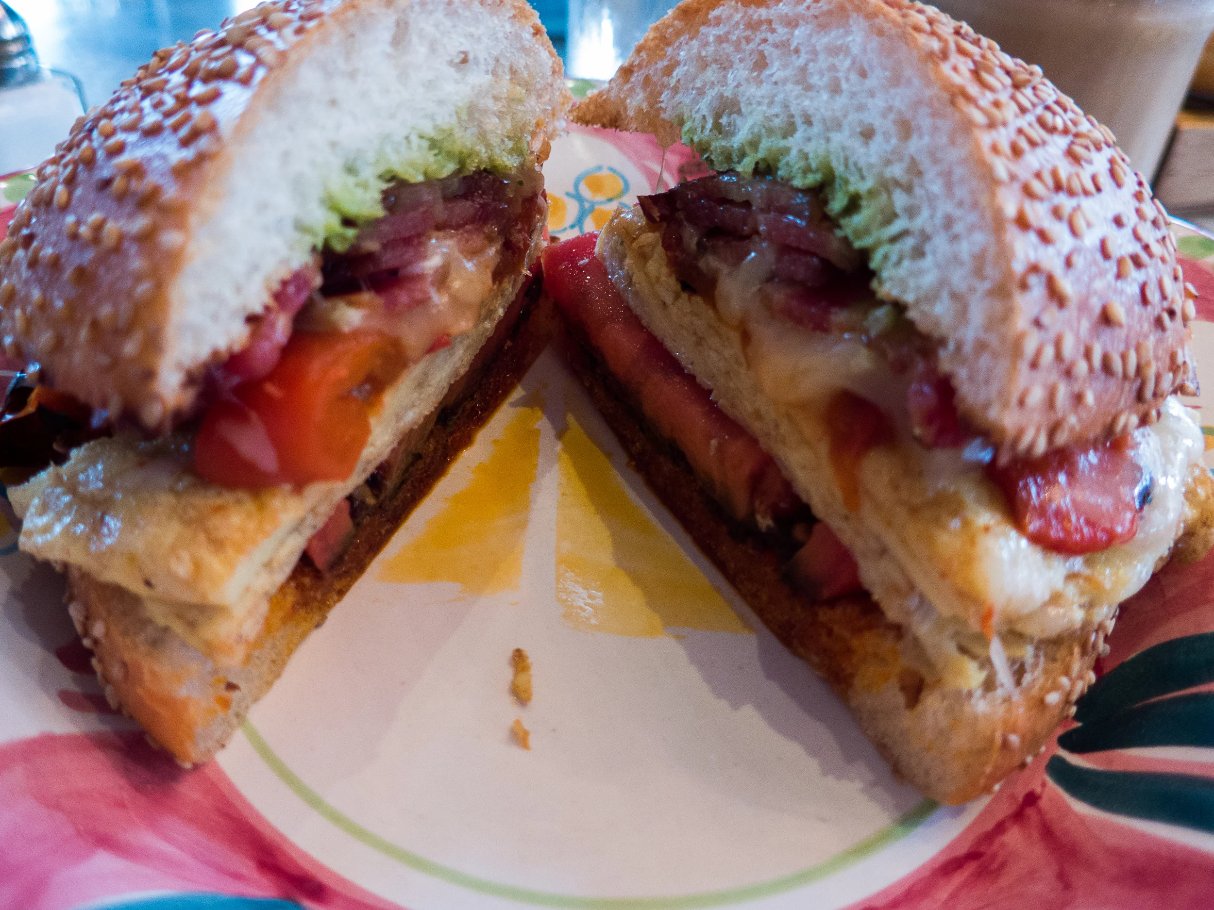 Bacon, egg and cheese turned up with tomato, peppers, pesto and tomato sofrito spreads.  