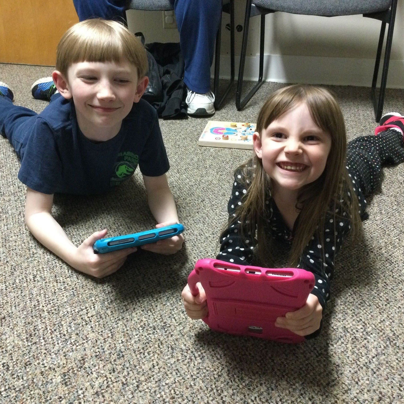 These cute kids in our Thermop clinic are demonstrating a great way for kids to prevent &quot;Tech Neck&quot; while using devices! While using technology, try to change positions frequently. 

This position puts your neck in the opposite position of 