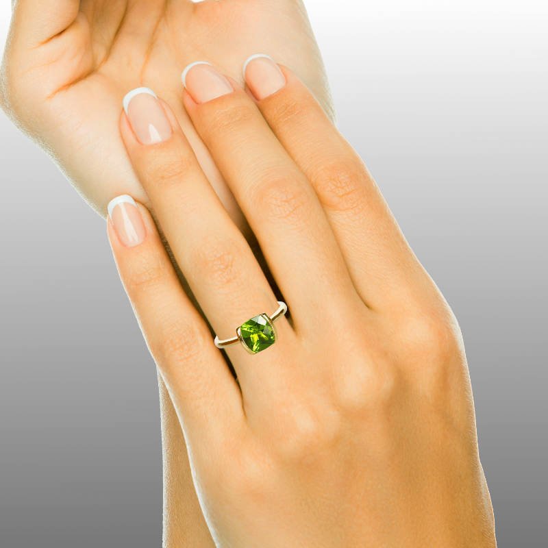 Peridot Solitaire Ring on Hand by Pratima Design Fine Art Jewelry Maui, Hawaii