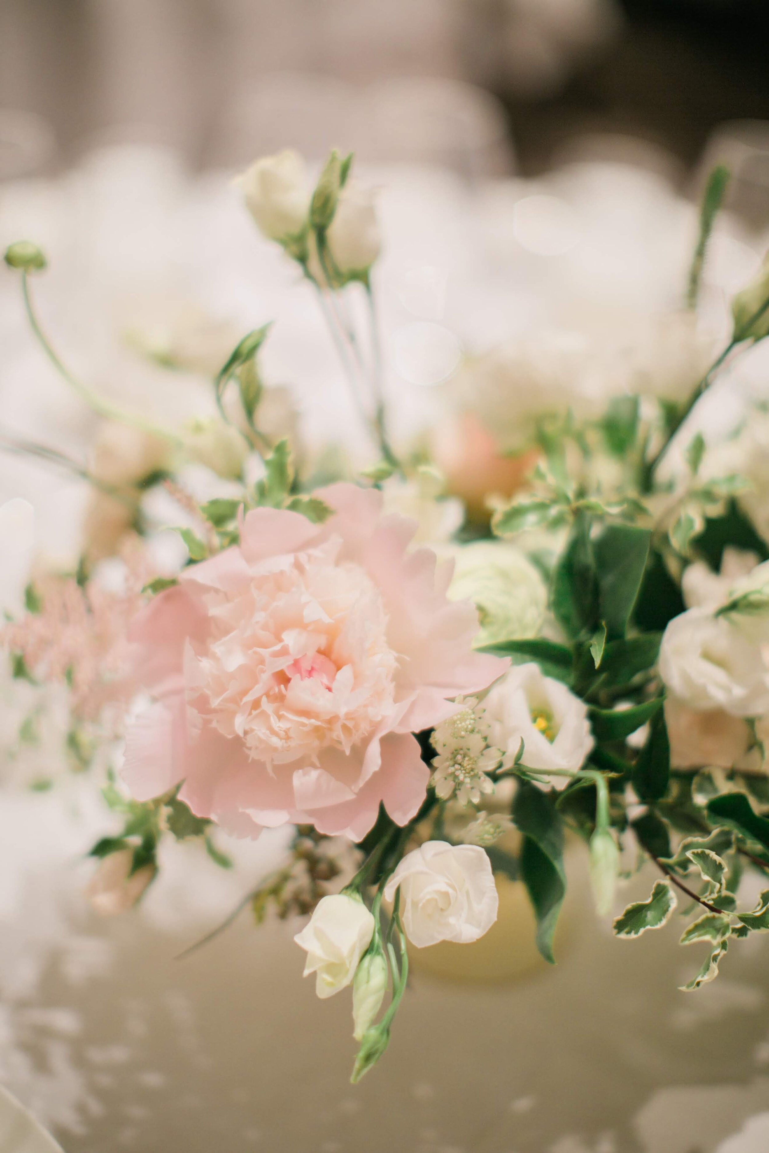 Stephanie & Anthony Rosewood Hotel Georgia Wedding. Beautiful floral centrepieces with peonies and roses by Celsia Floral blush and white colour palette | Keepsake Events