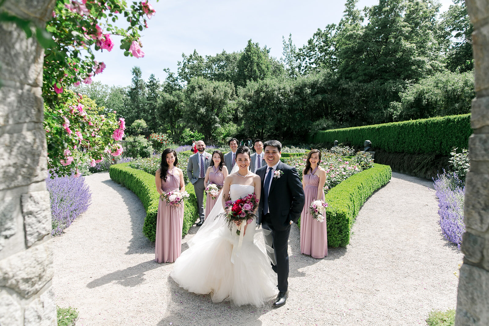 Jessica & Alex JW Marriott Parq Wedding. Wedding Party photos at Vandusen Gardens. Beautiful manicured garden and the bridesmaids in mauve purple matching dresses | Keepsake Events