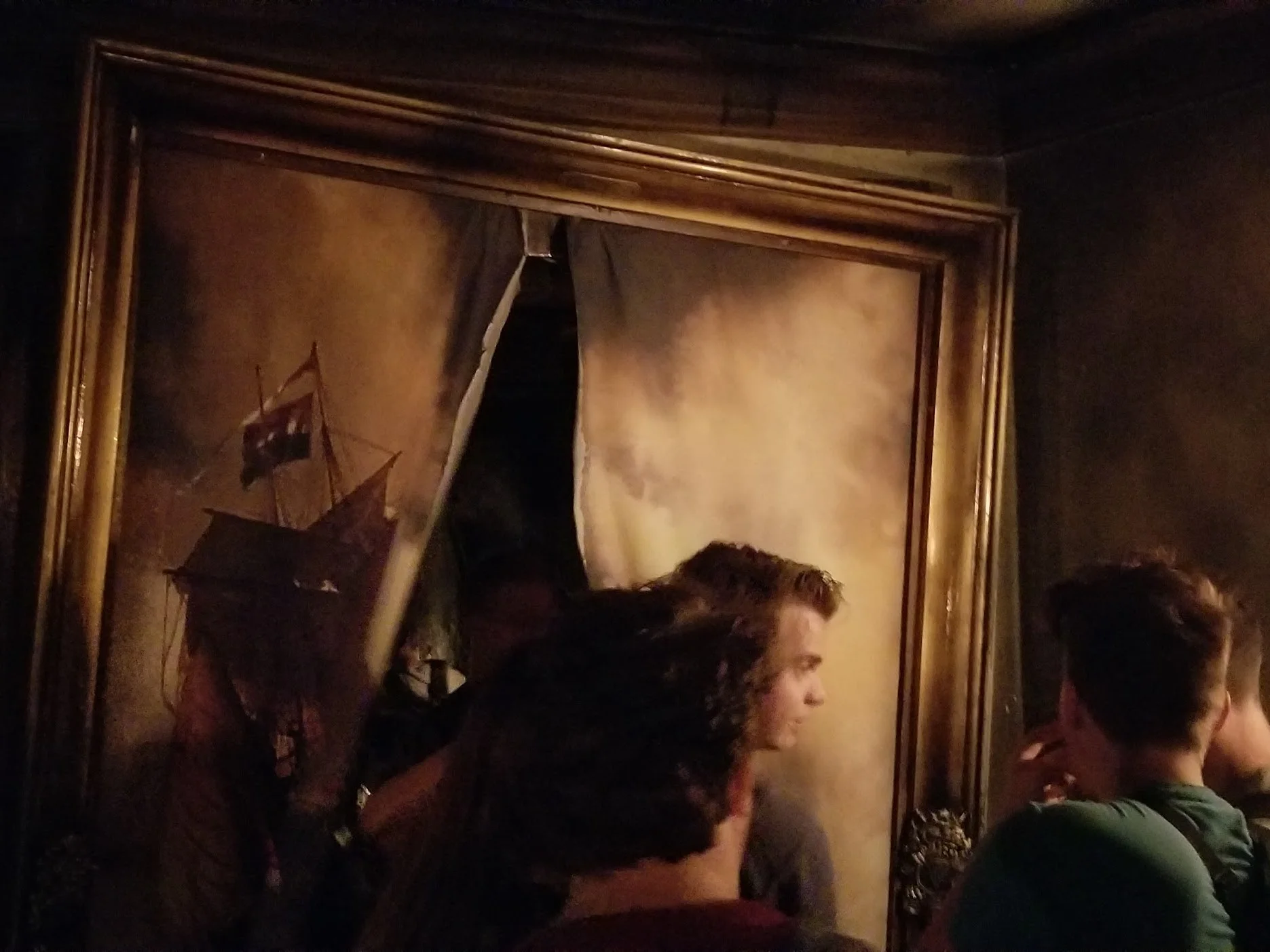 The Hollander boat ride had a more atmospheric wait, with many elements connecting to the pirate theme. We could peek through broken slats to see pirate treasure, and walk through a torn painting. Not all of the rides had such immersive lines, but there was always some consideration given to extend the experience of the ride through the wait.