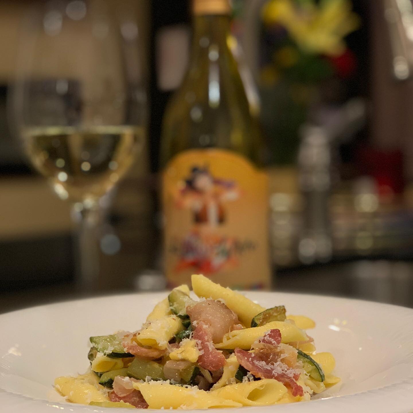 Italian Garganelli egg pasta with zucchini, red onion, pancetta e parmiggiano reggiano