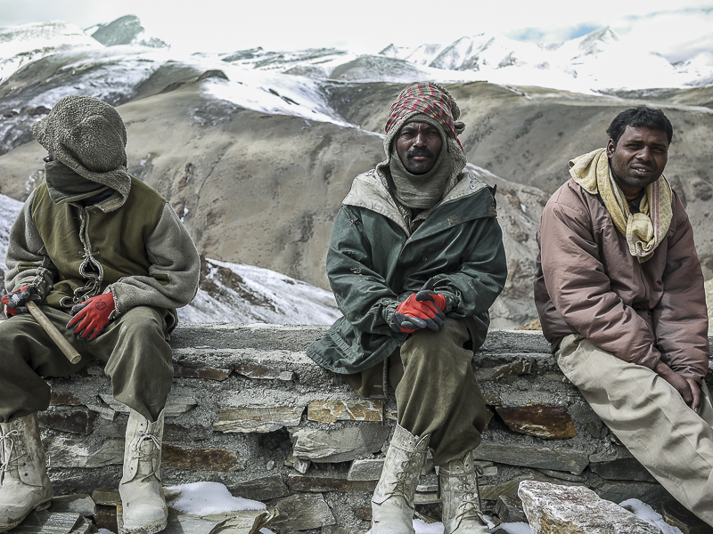 Young men wear a combination of military fatigues and local clothing from Bihar.