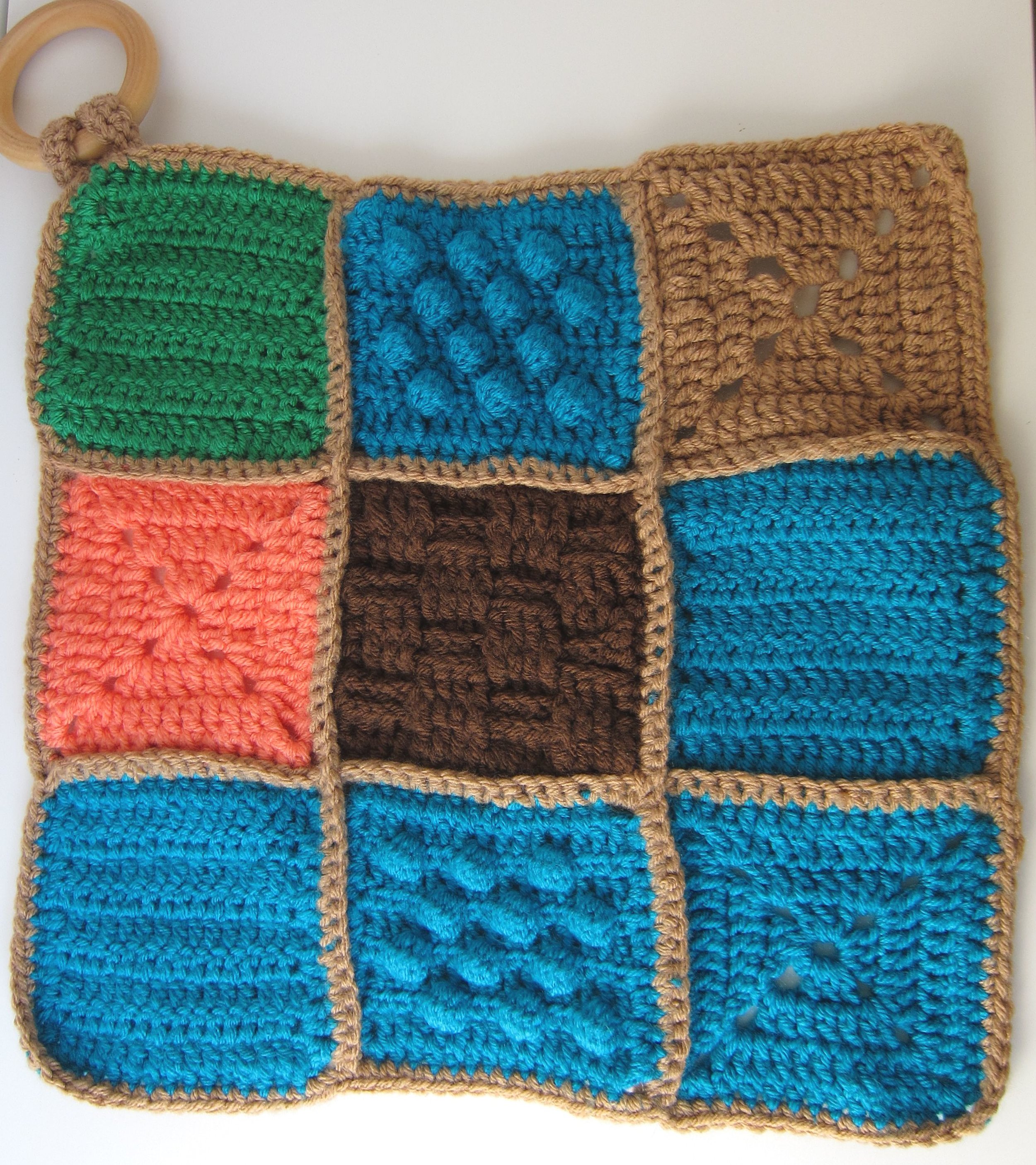 Colorful sensory lovey with natural teething ring 