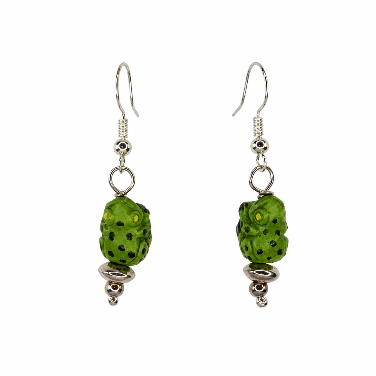 Pair of handmade green frog drop earrings with silver-tone accents on a light neutral background.