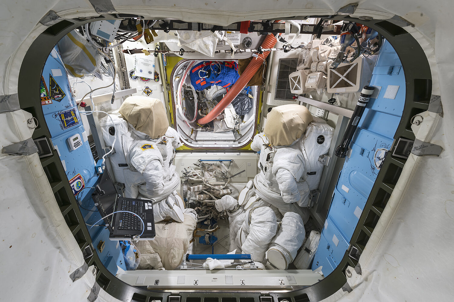 Starboard View through Port Hatch of Equipment Lock and Crew Lock with Extravehicular Activity Hardware
