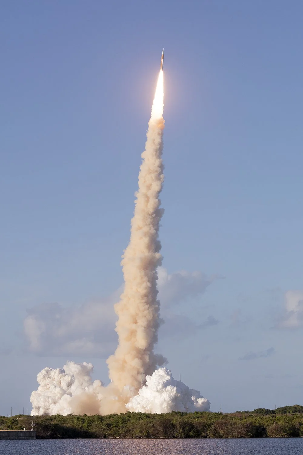 Solid Rocket Boosters leave a trail of smoke during the launch of Artemis 2