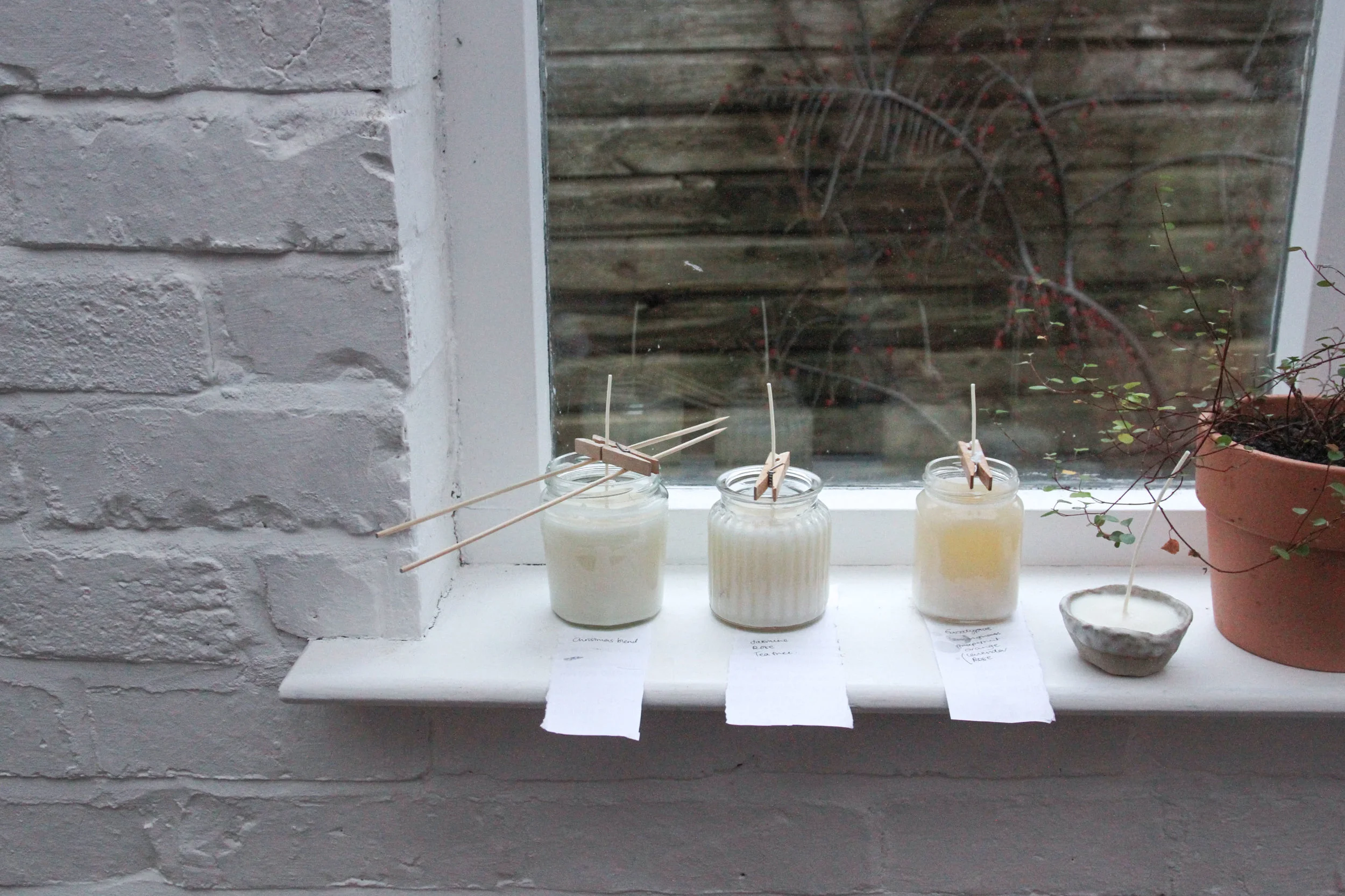 Homemade soy candles in a recycled jam jars