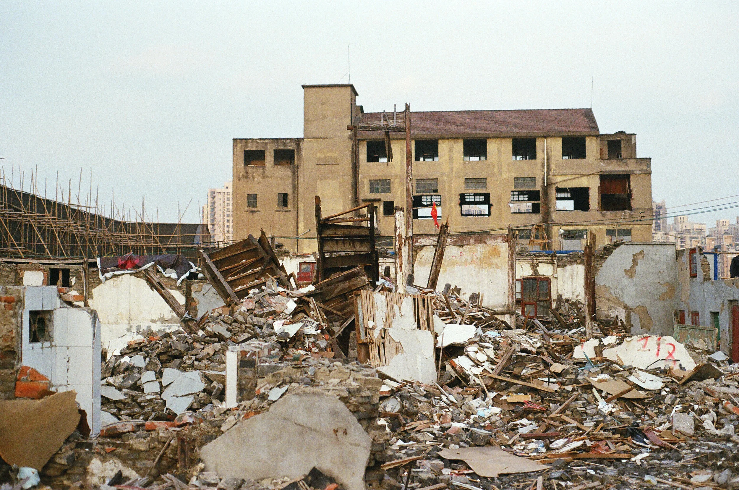yangpu district, shanghai, 2018. "chai." tearing down buildings. and chinese national flag.