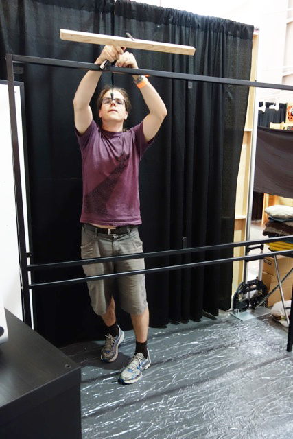 Benoit fitting lighting to powder coated steel frames. He was responsible for all display & booth design.