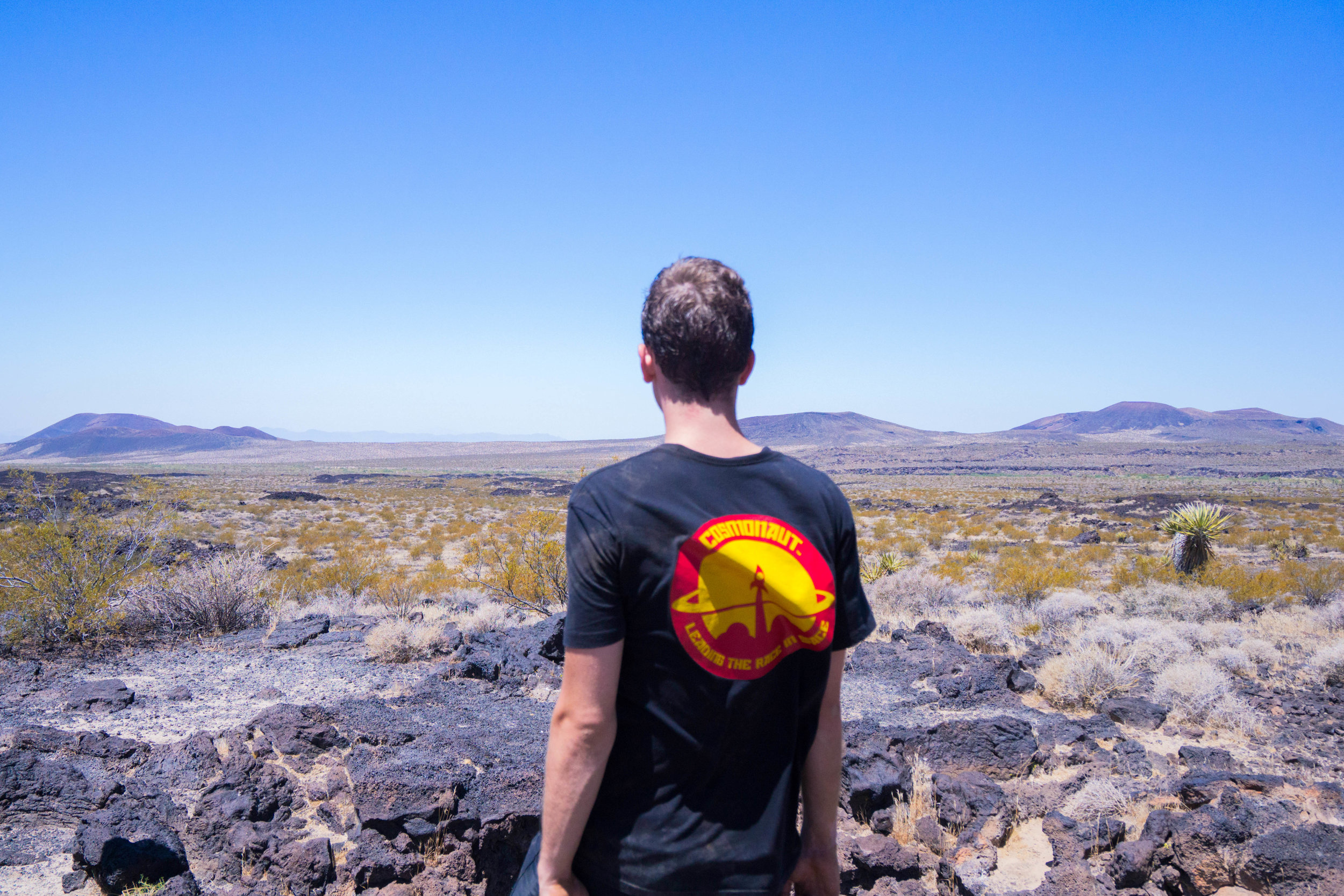 Searching for lava tubes as we scramble over ancient lava flow.