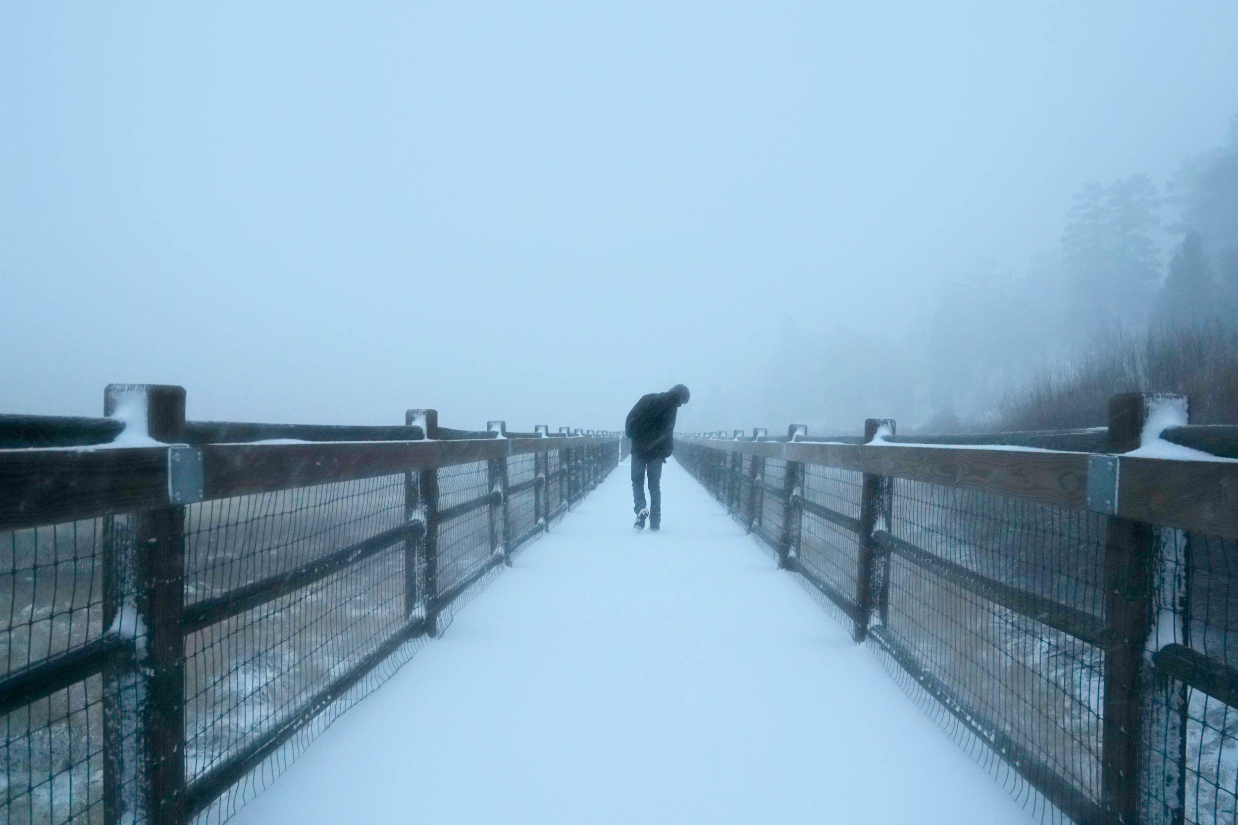 While most of the town flocked indoors, we couldn't help but continue the misadventure. We had the whole place to ourselves & laid down the 1st snowy footprints along this bridge.