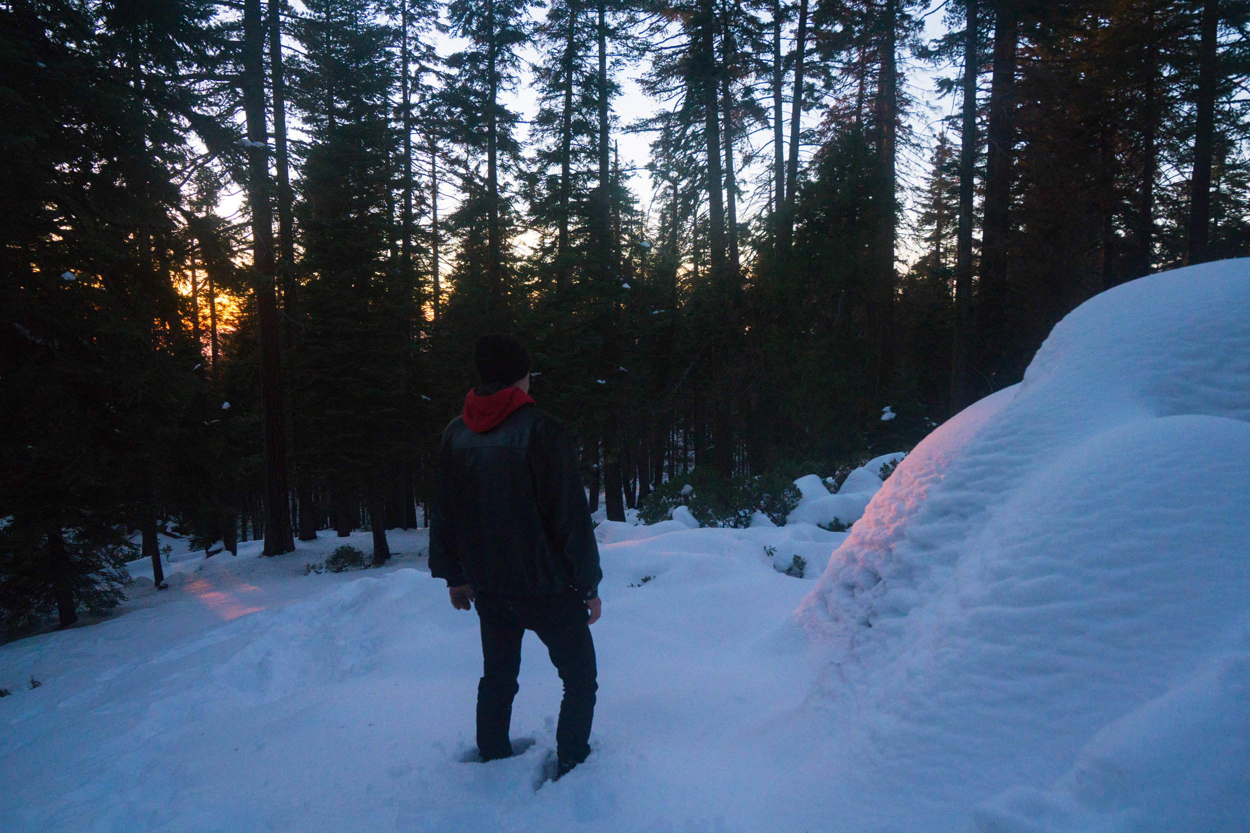 With camp now fully set up, we wander off to watch the last light diminish as the powdery snow glows a ruby red.